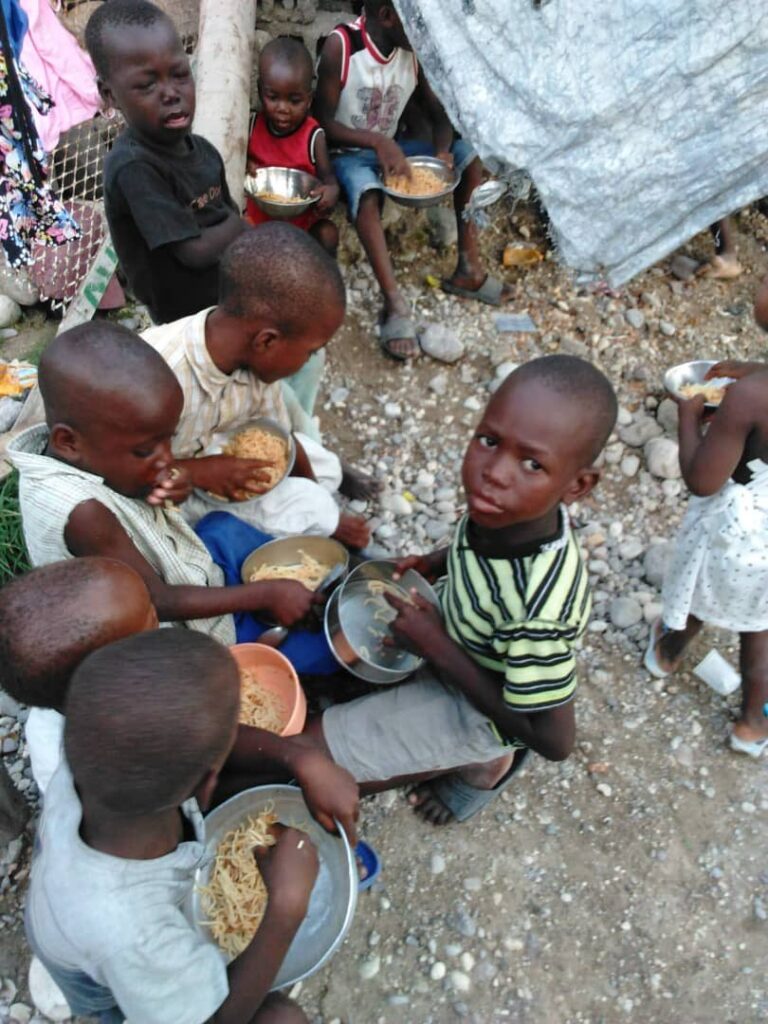Haitian children eating food